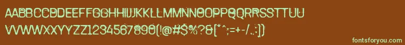 フォントTamettePunkdomed – 緑色の文字が茶色の背景にあります。