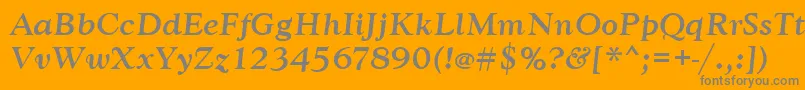 GoudytmedItalic-fontti – harmaat kirjasimet oranssilla taustalla