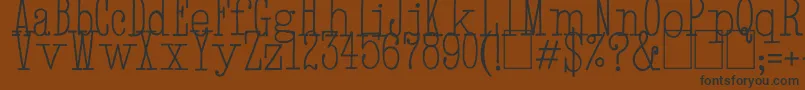HandTypewriter-fontti – mustat fontit ruskealla taustalla