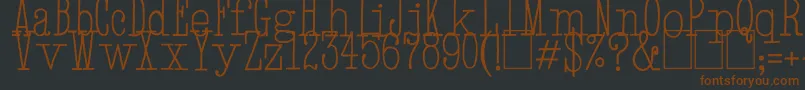 HandTypewriter-fontti – ruskeat fontit mustalla taustalla