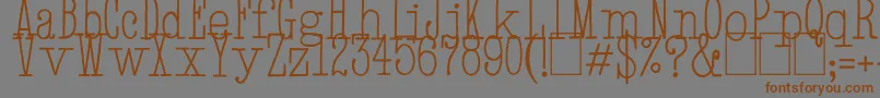 フォントHandTypewriter – 茶色の文字が灰色の背景にあります。