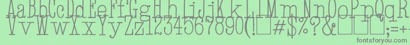 HandTypewriter-fontti – harmaat kirjasimet vihreällä taustalla