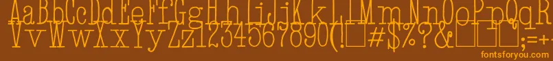 フォントHandTypewriter – オレンジ色の文字が茶色の背景にあります。