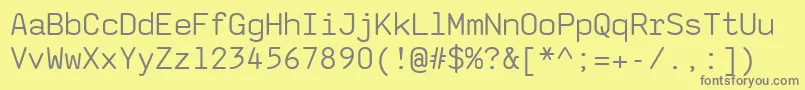 フォントSaxmono – 黄色の背景に灰色の文字