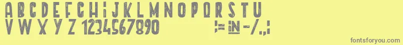 En savoir plus sur la police Unicorn+Paradise Police Unicorn+Paradise – polices grises sur fond jaune