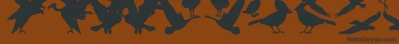 Czcionka BirdsOfAFeather – czarne czcionki na brązowym tle