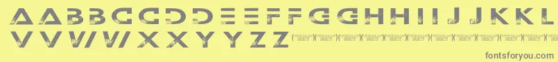 Outerspacemilitia-fontti – harmaat kirjasimet keltaisella taustalla