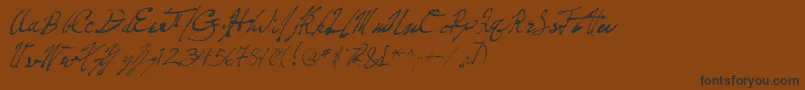 フォントPenFrenzy – 黒い文字が茶色の背景にあります