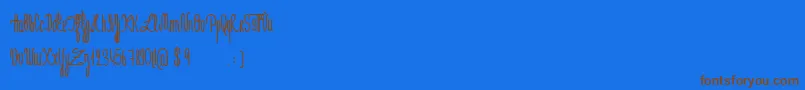 Czcionka JeNaimePasLeLundiBold – brązowe czcionki na niebieskim tle