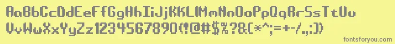フォントAesymatt – 黄色の背景に灰色の文字