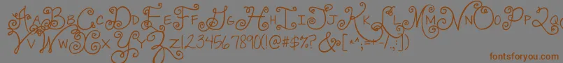 Jandaswirlygirl-Schriftart – Braune Schriften auf grauem Hintergrund