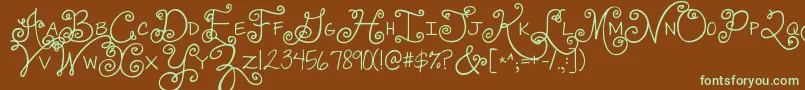 フォントJandaswirlygirl – 緑色の文字が茶色の背景にあります。
