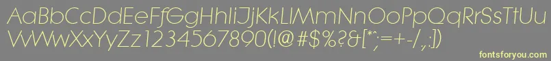 LiteraserialLightItalic-fontti – keltaiset fontit harmaalla taustalla