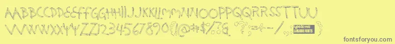 フォントHolysmok – 黄色の背景に灰色の文字