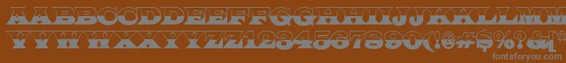 ALatinotitulbw-fontti – harmaat kirjasimet ruskealla taustalla