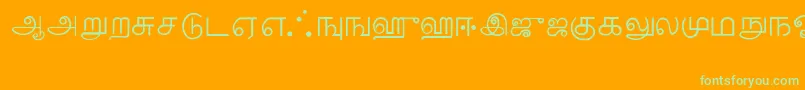 Tamil-Schriftart – Grüne Schriften auf orangefarbenem Hintergrund