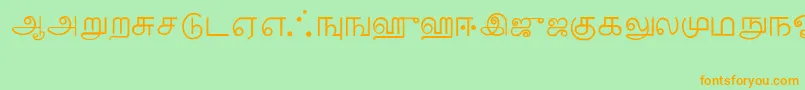 フォントTamil – オレンジの文字が緑の背景にあります。