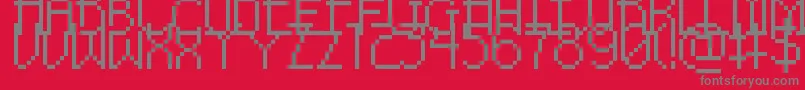 PixelNoirSkinnyCaps-fontti – harmaat kirjasimet punaisella taustalla