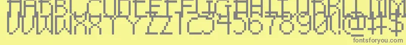 PixelNoirSkinnyCaps-Schriftart – Graue Schriften auf gelbem Hintergrund
