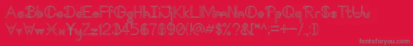 TooDamnFancyV1.1-fontti – harmaat kirjasimet punaisella taustalla