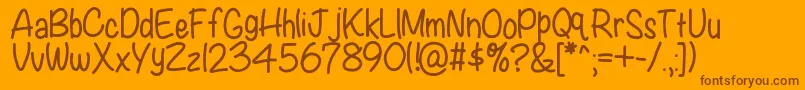 Kbwritersblock-Schriftart – Braune Schriften auf orangefarbenem Hintergrund
