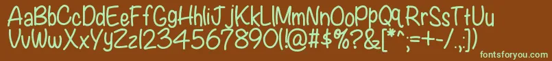 フォントKbwritersblock – 緑色の文字が茶色の背景にあります。