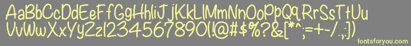 Kbwritersblock-Schriftart – Gelbe Schriften auf grauem Hintergrund
