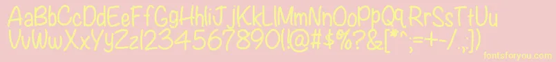 Fonte Kbwritersblock – fontes amarelas em um fundo rosa