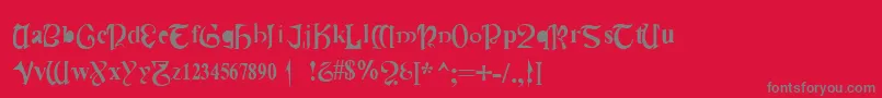 CauldronMedium-Schriftart – Graue Schriften auf rotem Hintergrund