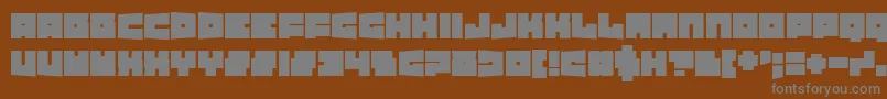 フォントTexasDrop – 茶色の背景に灰色の文字