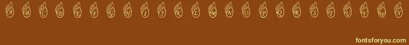 JennasShells Font – Yellow Fonts on Brown Background