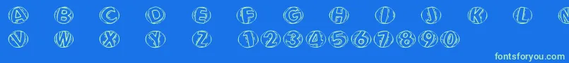 Fonte Woodcuttedcapsfs – fontes verdes em um fundo azul