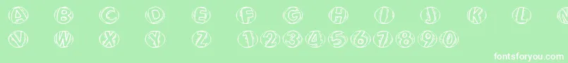 Woodcuttedcapsfs-Schriftart – Weiße Schriften auf grünem Hintergrund
