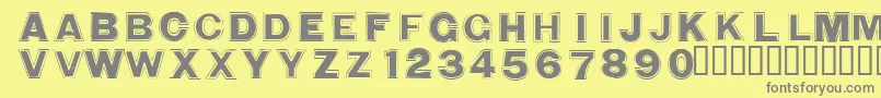 WashingmachineCloser-fontti – harmaat kirjasimet keltaisella taustalla