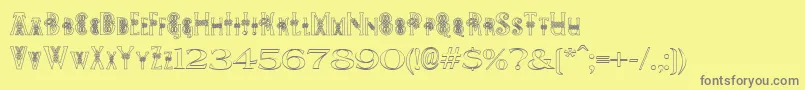 PeesCelticOutline Font – Gray Fonts on Yellow Background