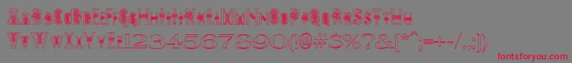 フォントPeesCelticOutline – 赤い文字の灰色の背景