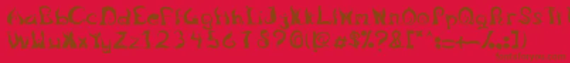 LegongDancingfont-Schriftart – Braune Schriften auf rotem Hintergrund