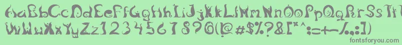 Fonte LegongDancingfont – fontes cinzas em um fundo verde