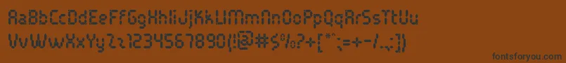 PocketCalcuatlorTt-fontti – mustat fontit ruskealla taustalla