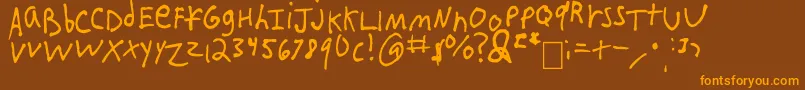 フォントIEatCrayons – オレンジ色の文字が茶色の背景にあります。