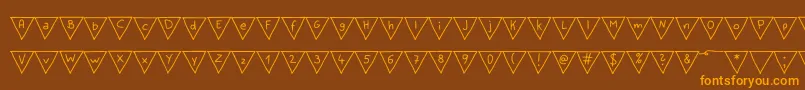 フォントPaperBannerRegular – オレンジ色の文字が茶色の背景にあります。