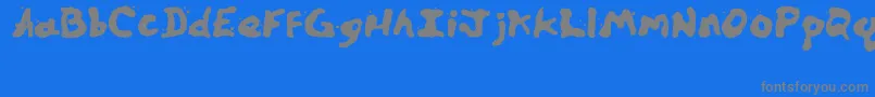 フォントZillspills – 青い背景に灰色の文字