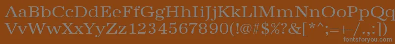 フォントUrwantiquatextwid – 茶色の背景に灰色の文字
