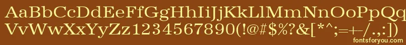 Urwantiquatextwid-fontti – keltaiset fontit ruskealla taustalla