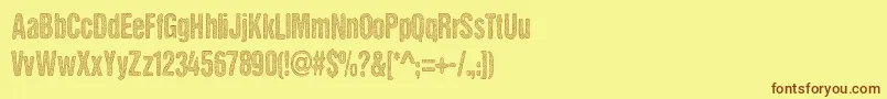 DccStainedAliens Font – Brown Fonts on Yellow Background