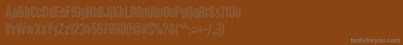 DccStainedAliens Font – Gray Fonts on Brown Background