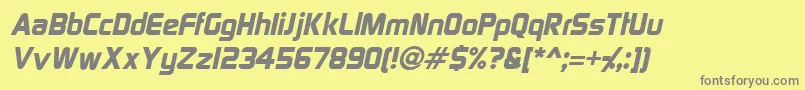SpaceGothicItalic-fontti – harmaat kirjasimet keltaisella taustalla