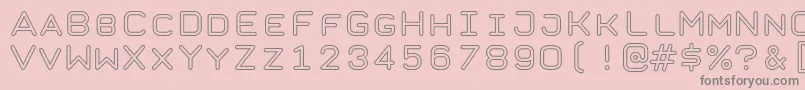 TaurusMonoOutlineRegular-Schriftart – Graue Schriften auf rosa Hintergrund