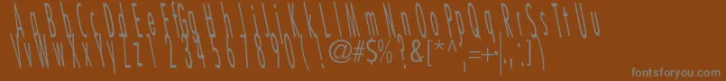 Czcionka CatscratchThinRevItalic – szare czcionki na brązowym tle
