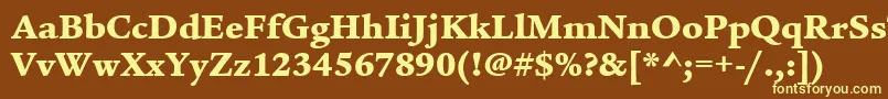 ItcLegacySerifLtUltra-fontti – keltaiset fontit ruskealla taustalla
